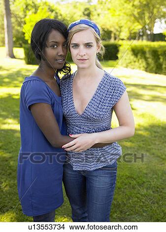 Girlfriends looking at camera View Large Photo Image Picture - Girlfriends looking at camera. Fotosearch