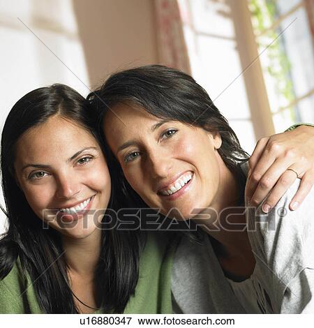Girlfriends smiling at camera View Large Photo Image Stock Photo - Girlfriends smiling at camera. Fotosearch