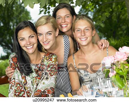 Stock Photo - Girlfriends smiling for the picture. Fotosearch