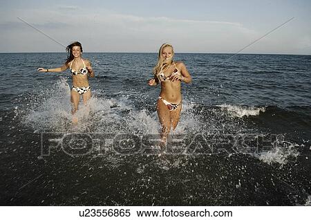 Girls teenagers playing in the sea View Large Photo Image Stock Photography - Girls teenagers playing in the sea. Fotosearch