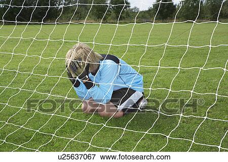 Goalkeeper with head in hands View Large Photo Image Stock Photo - Goalkeeper with head in hands. Fotosearch