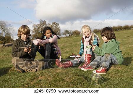 Group of children on hill View Large Photo Image Stock Image - Group of children on hill. Fotosearch