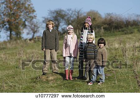 Stock Photo - Group of children on hill. Fotosearch