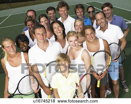 Stock Photo - Group of people on tennis court. Fotosearch