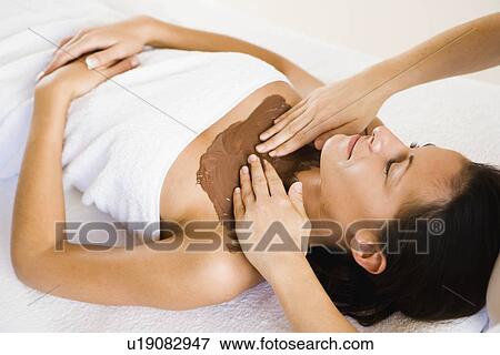 Stock Photo - Hands massaging cleavage. Fotosearch