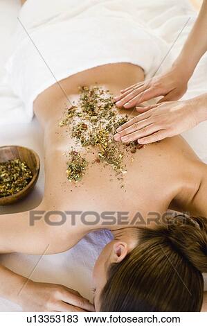 Hands massaging woman's back with herbs View Large Photo Image Stock Image - Hands massaging woman's back with herbs. Fotosearch