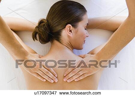 Stock Photo - Hands massaging woman's shoulders. Fotosearch