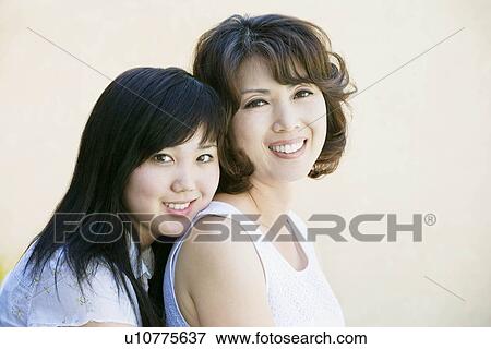 Stock Photo - "Happy, smiling mother and daughter". Fotosearch