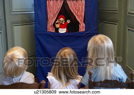 Kids watching a puppet show View Large Photo Image Stock Photo - Kids watching a puppet show. Fotosearch