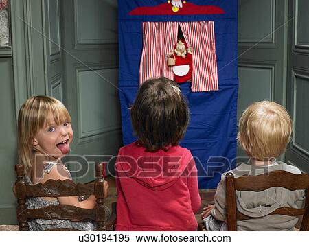Kids watching a puppet show View Large Photo Image Stock Photography - Kids watching a puppet show. Fotosearch