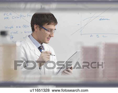 Stock Photo - Laboratory technician and whiteboard. Fotosearch