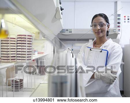Laboratory technician with clipboard View Large Photo Image Stock Image - Laboratory technician with clipboard. Fotosearch