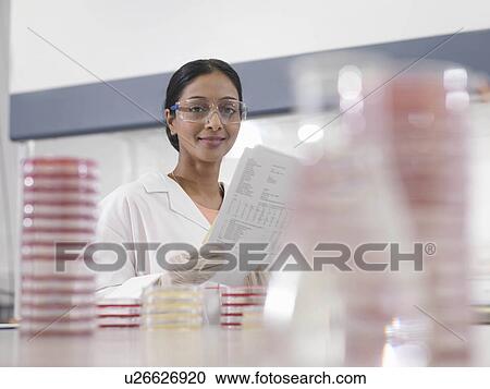 Laboratory technician with notes View Large Photo Image Stock Image - Laboratory technician with notes. Fotosearch