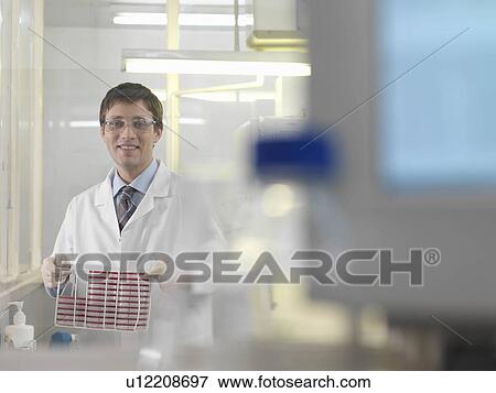 Laboratory technician with petri dishes View Large Photo Image Stock Photo - Laboratory technician with petri dishes. Fotosearch