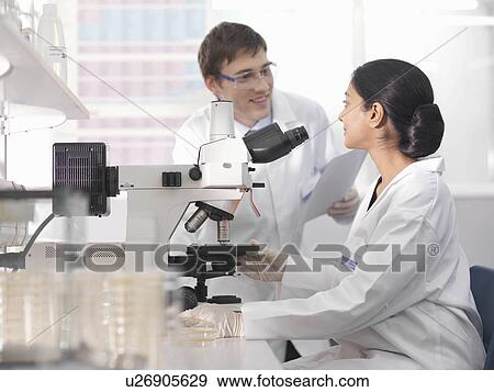 Laboratory technicians and microscope View Large Photo Image Stock Photo - Laboratory technicians and microscope. Fotosearch