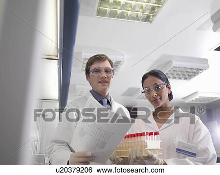 Laboratory technicians at work View Large Photo Image Stock Photograph - Laboratory technicians at work. Fotosearch