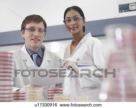 Laboratory technicians with notes View Large Photo Image Stock Photograph - Laboratory technicians with notes. Fotosearch