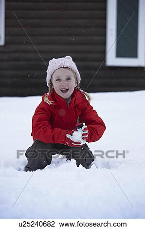 Little girl playing in snow View Large Photo Image Stock Image - Little girl playing in snow. Fotosearch