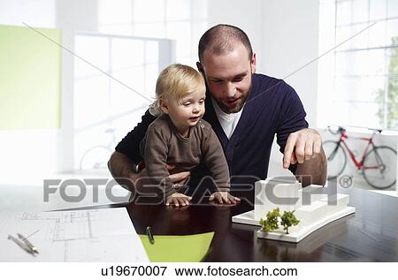 Male architect with baby View Large Photo Image Stock Photo - Male architect with baby. Fotosearch