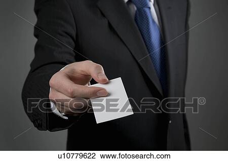 Male holding business card View Large Photo Image Stock Image - Male holding business card. Fotosearch