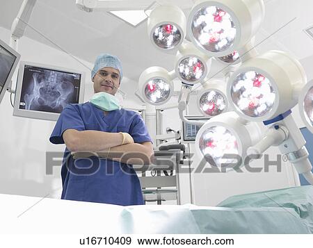 Stock Photo - Male nurse in operating theatre. Fotosearch