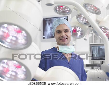 Stock Photograph - Male nurse in operating theatre. Fotosearch
