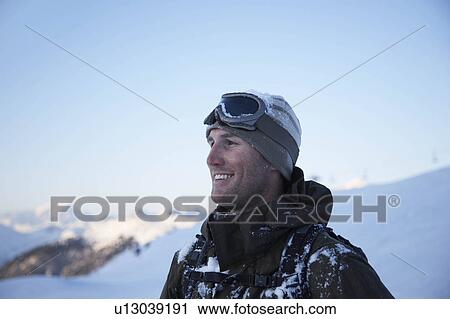Male skier with snow on jacket View Large Photo Image Stock Image - Male skier with snow on jacket. Fotosearch