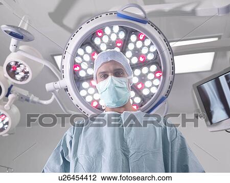 Male surgeon in operating theatre View Large Photo Image Stock Image - Male surgeon in operating theatre. Fotosearch