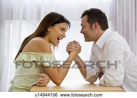 Man and Woman arm wresting View Large Photo Image Stock Photograph - Man and Woman arm wresting. Fotosearch