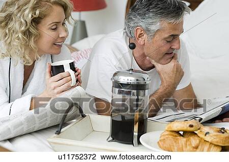 Man and woman having breakfast View Large Photo Image Stock Image - Man and woman having breakfast. Fotosearch