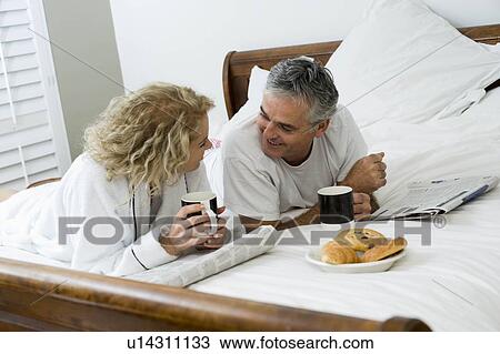 Man and woman having breakfast View Large Photo Image Stock Image - Man and woman having breakfast. Fotosearch