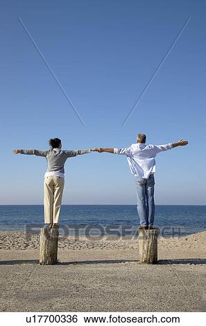 Man and woman looking at sea View Large Photo Image Stock Photograph - Man and woman looking at sea. Fotosearch