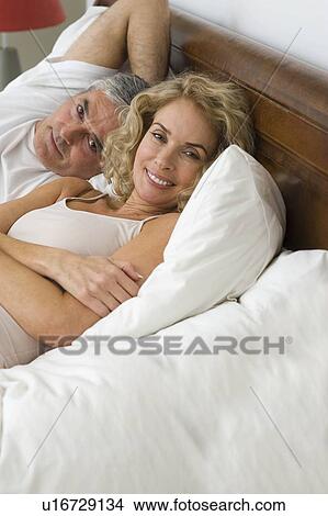 Picture - Man and woman relaxing. Fotosearch
