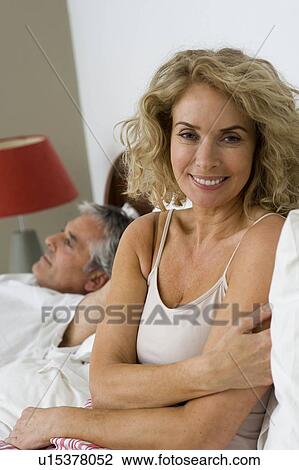 Stock Image - Man and woman relaxing. Fotosearch