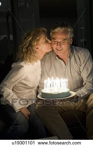 Man and woman with cake View Large Photo Image Stock Image - Man and woman with cake. Fotosearch