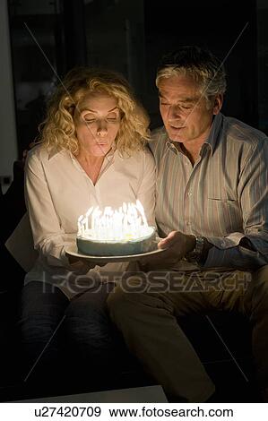 Man and woman with cake View Large Photo Image Stock Photo - Man and woman with cake. Fotosearch