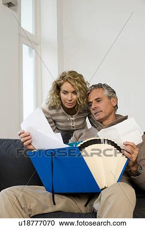 Stock Image - Man and woman working at home. Fotosearch