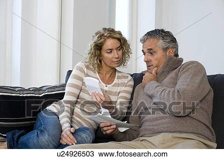 Stock Image - Man and woman working at home. Fotosearch