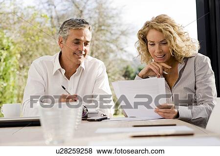 Man and Woman working together View Large Photo Image Stock Photo - Man and Woman working together. Fotosearch