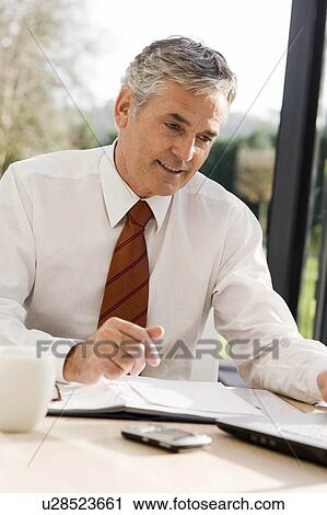 Stock Image - Man at work. Fotosearch