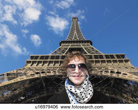 Stock Photograph - Man in front of Eiffel tower. Fotosearch