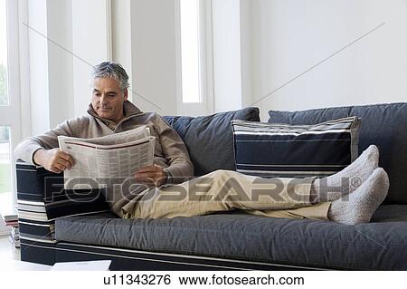 Stock Photograph - Man reading newspaper. Fotosearch