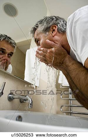 Man washing face View Large Photo Image Stock Image - Man washing face. Fotosearch