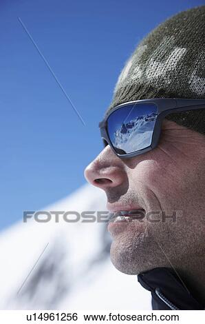 Man wearing sunglasses on mountain View Large Photo Image Stock Photograph - Man wearing sunglasses on mountain. Fotosearch
