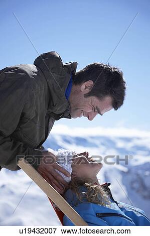 Stock Photo - Man with woman sitting in deck chair. Fotosearch
