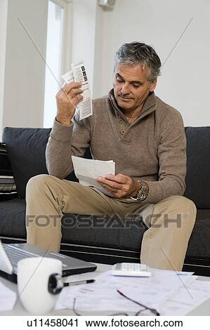 Stock Image - Man working at home. Fotosearch