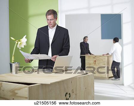 Stock Photograph - Manager in green office. Fotosearch