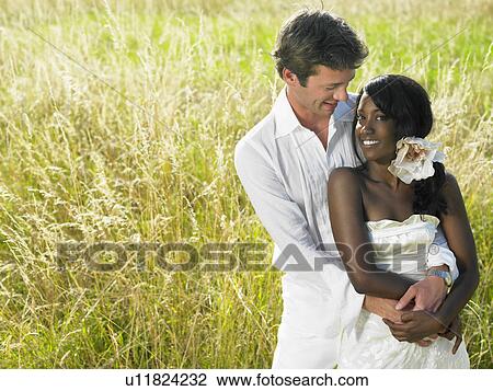 Married couple in a field View Large Photo Image Stock Image - Married couple in a field. Fotosearch