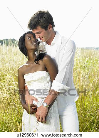 Married couple in a field View Large Photo Image Stock Image - Married couple in a field. Fotosearch