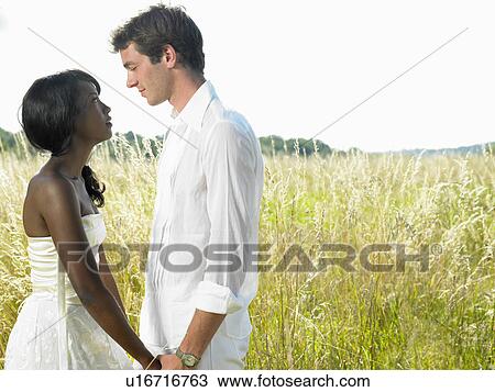 Married couple in a field View Large Photo Image Stock Image - Married couple in a field. Fotosearch